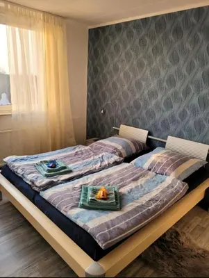 Ein Bett oder Betten in einem Zimmer der Unterkunft Sarra&Mo Ferienwohnung