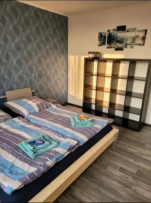 Ein Bett oder Betten in einem Zimmer der Unterkunft Sarra&Mo Ferienwohnung