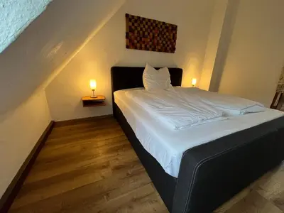 Ein Bett oder Betten in einem Zimmer der Unterkunft Dachgeschosswohnung im 3-Städteeck