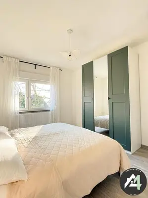 Ein Bett oder Betten in einem Zimmer der Unterkunft Apartment4