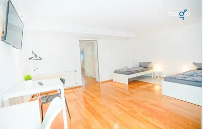 Ein Bett oder Betten in einem Zimmer der Unterkunft BEGE APARTMENTS TeamHome