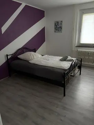 Ein Bett oder Betten in einem Zimmer der Unterkunft Red Dot Apartment Lucky