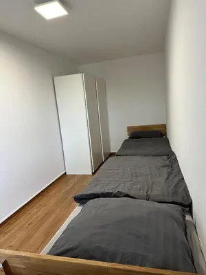 Ein Bett oder Betten in einem Zimmer der Unterkunft Business Apartment in Duisburg 400m weit von Hbf