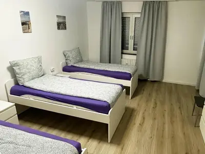 Ein Bett oder Betten in einem Zimmer der Unterkunft Apartments in Bergkamen
