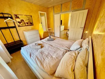 Ein Bett oder Betten in einem Zimmer der Unterkunft Top ausgestattet 3,5 Zimmerwohnung in GE-Hessler