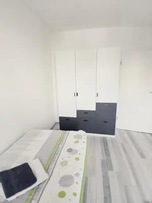 Ein Bett oder Betten in einem Zimmer der Unterkunft A&M APARTMENT-Ideal für Familie, Freunde, Monteure