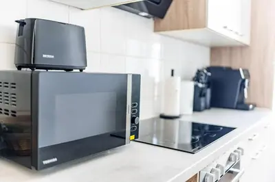 Küche/Küchenzeile in der Unterkunft Modernes Apartment für 5 Personen mit Privatüarkplatz - Wlan und Kaffeevollautomat