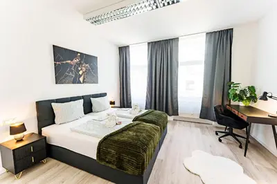 Ein Bett oder Betten in einem Zimmer der Unterkunft Modernes Apartment für 5 Personen mit Privatüarkplatz - Wlan und Kaffeevollautomat