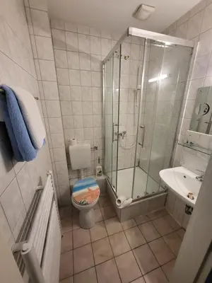 Ein Badezimmer in der Unterkunft Hotel Schlaun
