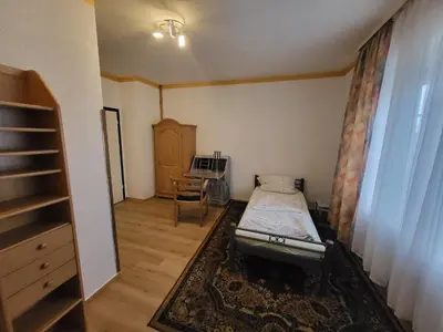 Ein Bett oder Betten in einem Zimmer der Unterkunft Hotel Schlaun