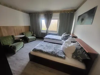 Ein Bett oder Betten in einem Zimmer der Unterkunft Hotel Schlaun