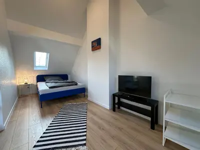 Ein Bett oder Betten in einem Zimmer der Unterkunft Ferienhaus im Duisburger Norden - bis zu 8 Personen - Arbeiten im Ruhrgebiet