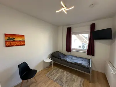 Ein Bett oder Betten in einem Zimmer der Unterkunft Ferienhaus im Duisburger Norden - bis zu 8 Personen - Arbeiten im Ruhrgebiet