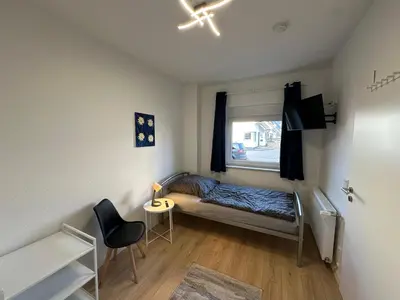 Ein Bett oder Betten in einem Zimmer der Unterkunft Ferienhaus im Duisburger Norden - bis zu 8 Personen - Arbeiten im Ruhrgebiet
