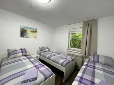 Ein Bett oder Betten in einem Zimmer der Unterkunft Voll ausgestattetes Apartment in Essen