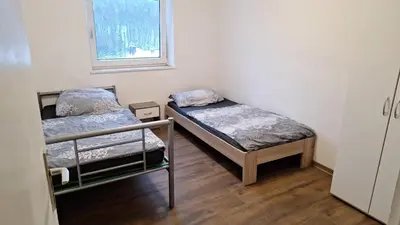 Ein Bett oder Betten in einem Zimmer der Unterkunft Ganze Wohnung in Wülfrath mit Balkon 4 Gäste