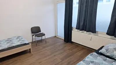 Ein Bett oder Betten in einem Zimmer der Unterkunft Ganze Wohnung in Wülfrath mit Balkon 4 Gäste