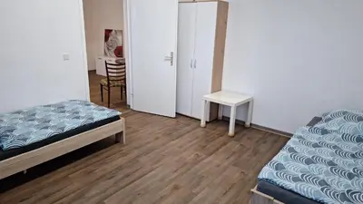 Ein Bett oder Betten in einem Zimmer der Unterkunft Ganze Wohnung in Wülfrath mit Balkon 4 Gäste