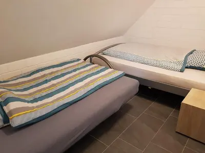 Ein Bett oder Betten in einem Zimmer der Unterkunft Alte Werkstatt - Monteurwohnung auf dem Land