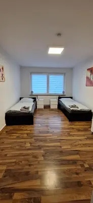 Ein Bett oder Betten in einem Zimmer der Unterkunft Mariia