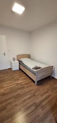 Ein Bett oder Betten in einem Zimmer der Unterkunft Mariia