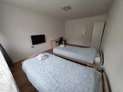 Ein Bett oder Betten in einem Zimmer der Unterkunft Einzelzimmer für bis zu 2 Personen - 3 OG