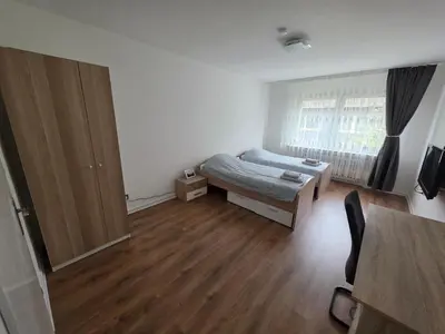 Ein Bett oder Betten in einem Zimmer der Unterkunft Einzelzimmer für bis zu 2 Personen - 3 OG