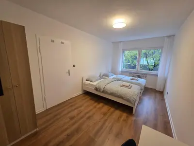 Ein Bett oder Betten in einem Zimmer der Unterkunft Doppelzimmer für bis zu 4 Personen - 3 OG