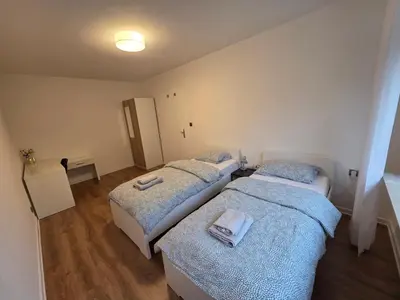 Ein Bett oder Betten in einem Zimmer der Unterkunft Doppelzimmer für bis zu 4 Personen - 3 OG