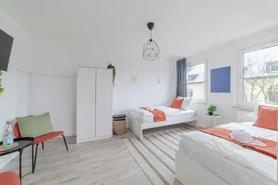 Ein Bett oder Betten in einem Zimmer der Unterkunft SpaceStays Apartment 4 Personen WLAN Smart-TV