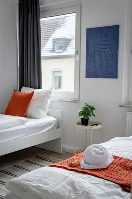 Ein Bett oder Betten in einem Zimmer der Unterkunft SpaceStays Apartment 4 Personen WLAN Smart-TV