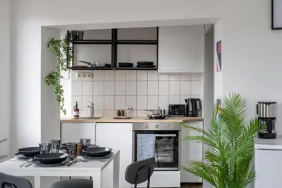 Küche/Küchenzeile in der Unterkunft SpaceStays Apartment 4 Personen WLAN Smart-TV