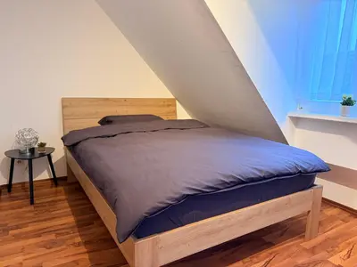 Ein Bett oder Betten in einem Zimmer der Unterkunft Stillvolle Wohnung mitten in Hattingen-Altstadt
