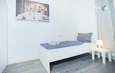 Ein Bett oder Betten in einem Zimmer der Unterkunft BEGE APARTMENTS WorkSpot