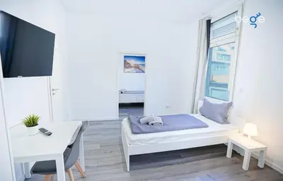 Ein Bett oder Betten in einem Zimmer der Unterkunft BEGE APARTMENTS WorkSpot