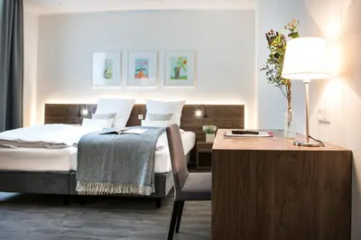 Ein Bett oder Betten in einem Zimmer der Unterkunft Alexianer Hotel am Wasserturm