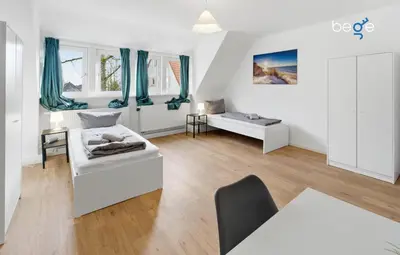 Ein Bett oder Betten in einem Zimmer der Unterkunft BEGE APARTMENTS UrbanStay