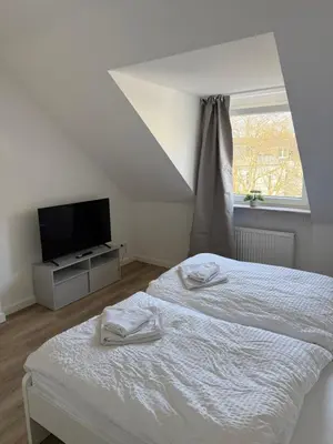 Ein Bett oder Betten in einem Zimmer der Unterkunft Two-Bedroom Apartment