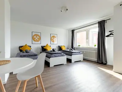 Ein Sitzbereich in der Unterkunft BudgetRoom 3 Betten Küche Bad Studio