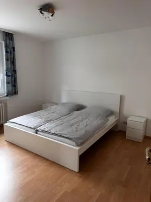 Ein Bett oder Betten in einem Zimmer der Unterkunft Große Wohnung verkehrsgünstig im Zentrum Duisburgs