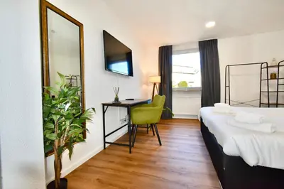 Ein Bett oder Betten in einem Zimmer der Unterkunft SANO - Hagen - Am Rastebaum