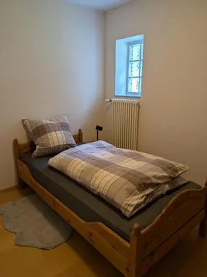 Ein Bett oder Betten in einem Zimmer der Unterkunft Ferienwohnung Bauernhofromantik
