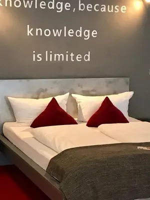 Ein Bett oder Betten in einem Zimmer der Unterkunft home2be apartments
