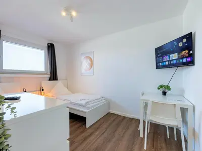 Ein Bett oder Betten in einem Zimmer der Unterkunft BudgetRoom 3 Schlafzimmer Workers Home