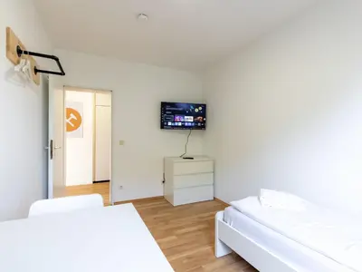 Ein Bett oder Betten in einem Zimmer der Unterkunft BudgetRoom 3 Schlafzimmer Workers Home