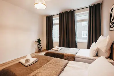 Ein Bett oder Betten in einem Zimmer der Unterkunft ATLAS Apartment 6 Oberhausen, 3 Zimmer, Nähe Bahnhof, Westfield Centro