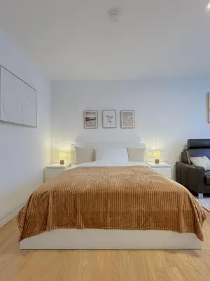 Ein Bett oder Betten in einem Zimmer der Unterkunft Dein Apartment mit Queensize Bett im Erdgeschoss