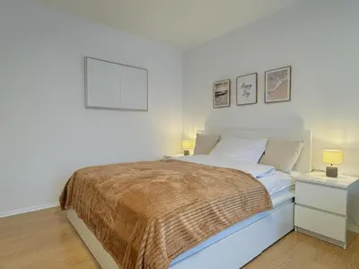 Ein Bett oder Betten in einem Zimmer der Unterkunft Dein Apartment mit Queensize Bett im Erdgeschoss