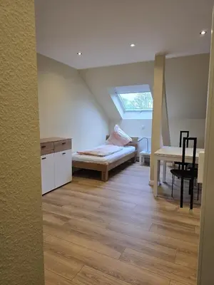 Ein Bett oder Betten in einem Zimmer der Unterkunft Hotel & Landgasthaus Im kühlen Grund