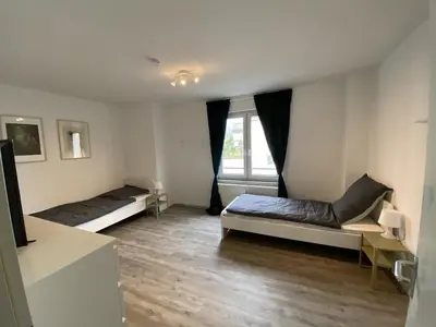 Ein Bett oder Betten in einem Zimmer der Unterkunft SAP18 fitter's apartment in Erkrath